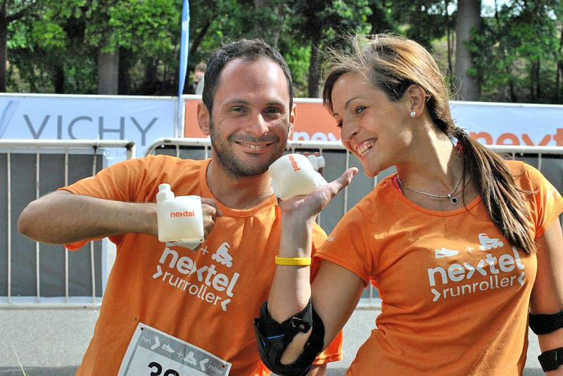 A couple at the Nextel run/roller race wearing custom-branded Swiggies wrist water bottles